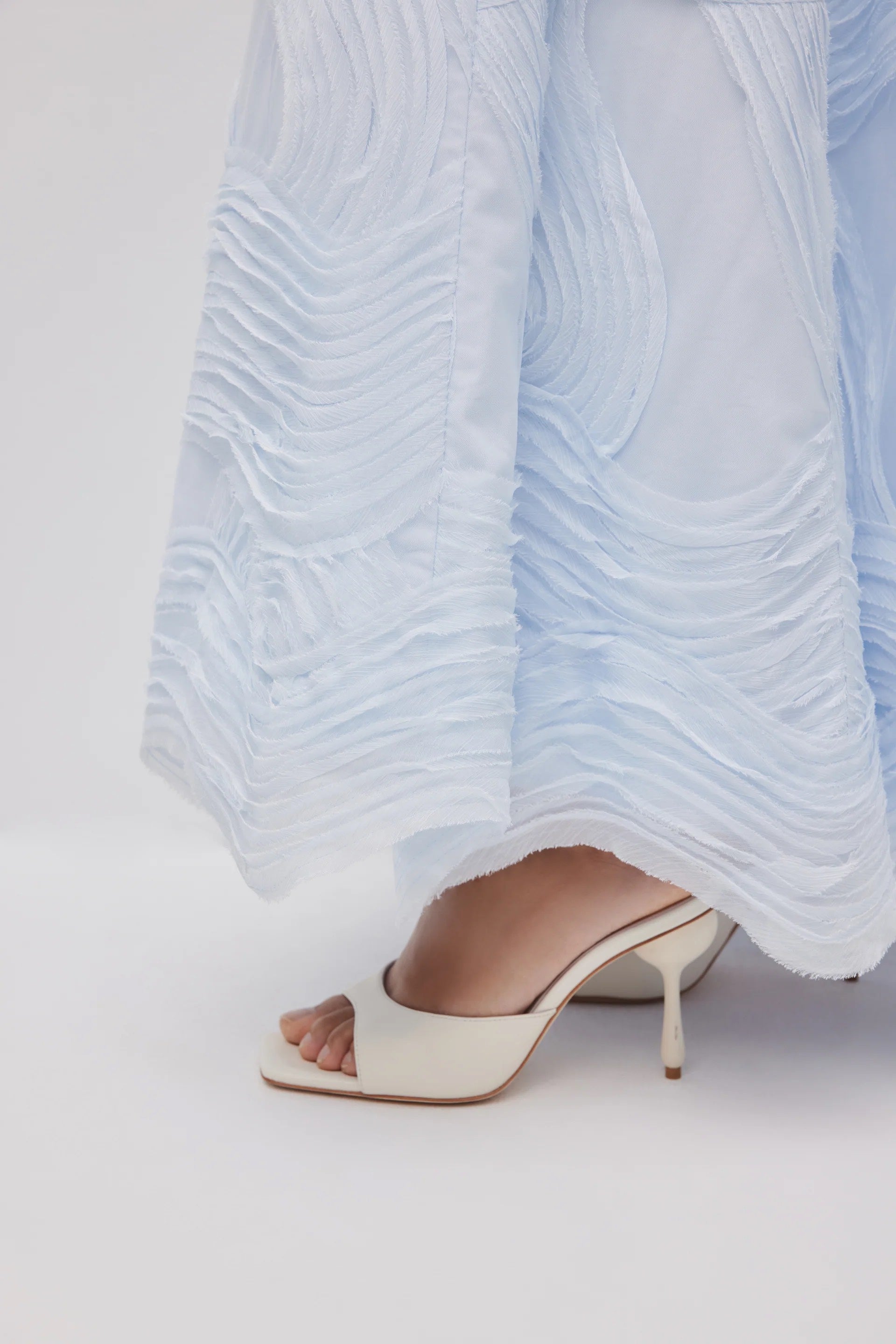 Aje Wave Gown in Pastel Blue Hem View